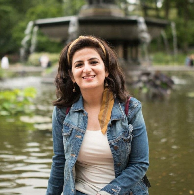 Aishwarya Vohra smiling near a fountain