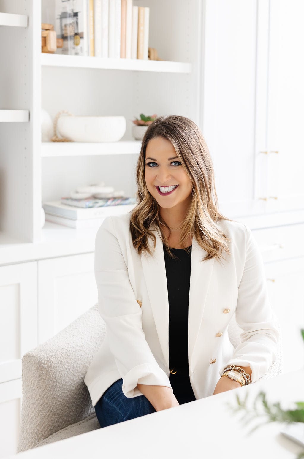 Marcia Church headshot smiling in white blazer