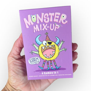 Hand holding Monster Mix-Up game box