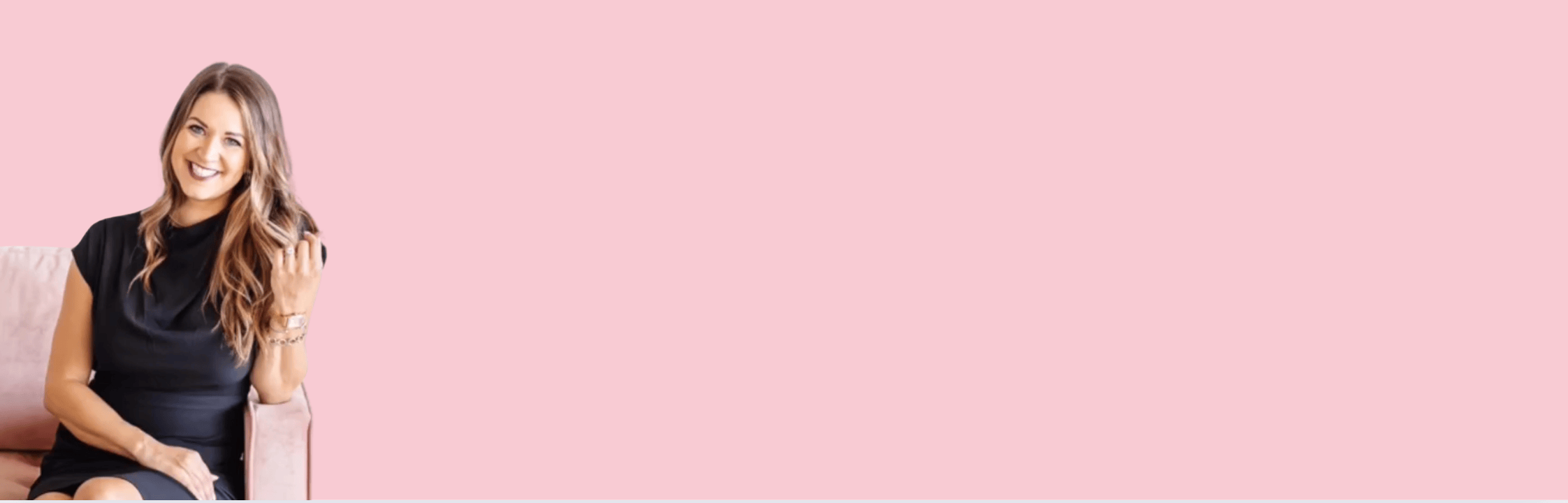 Woman in black dress on pink background, screenshot August 5, 2025.