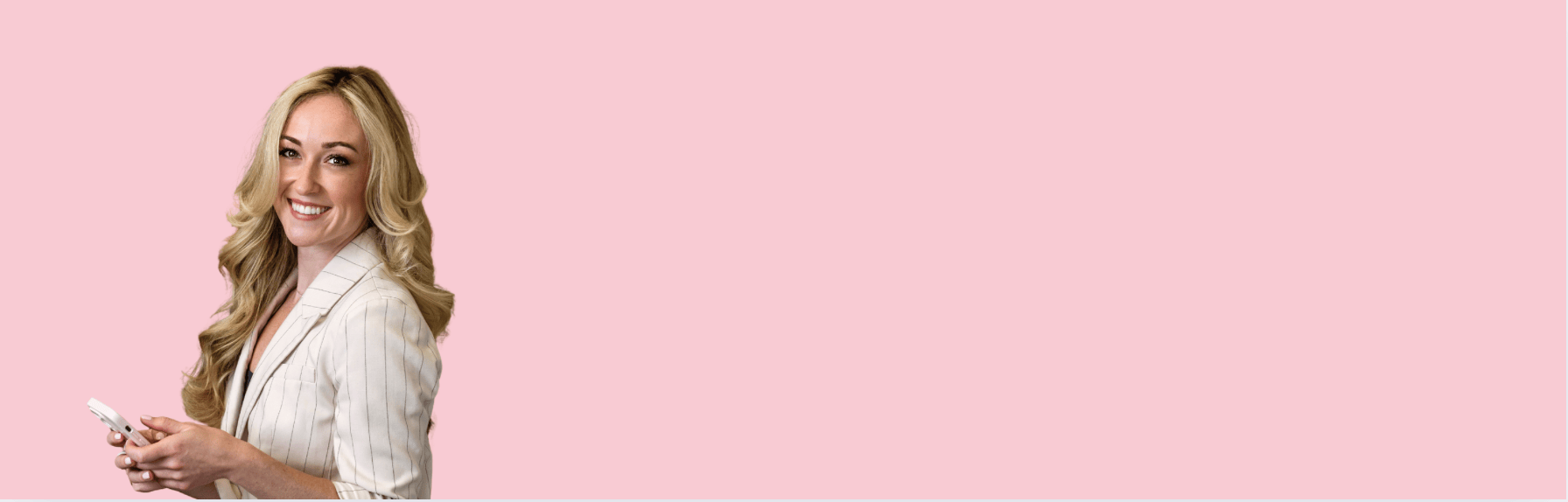 Smiling woman in blazer, screenshot from August 12, 2025.