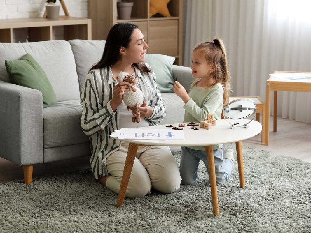 speech therapist using the best speech therapy toys with a young girl during a session