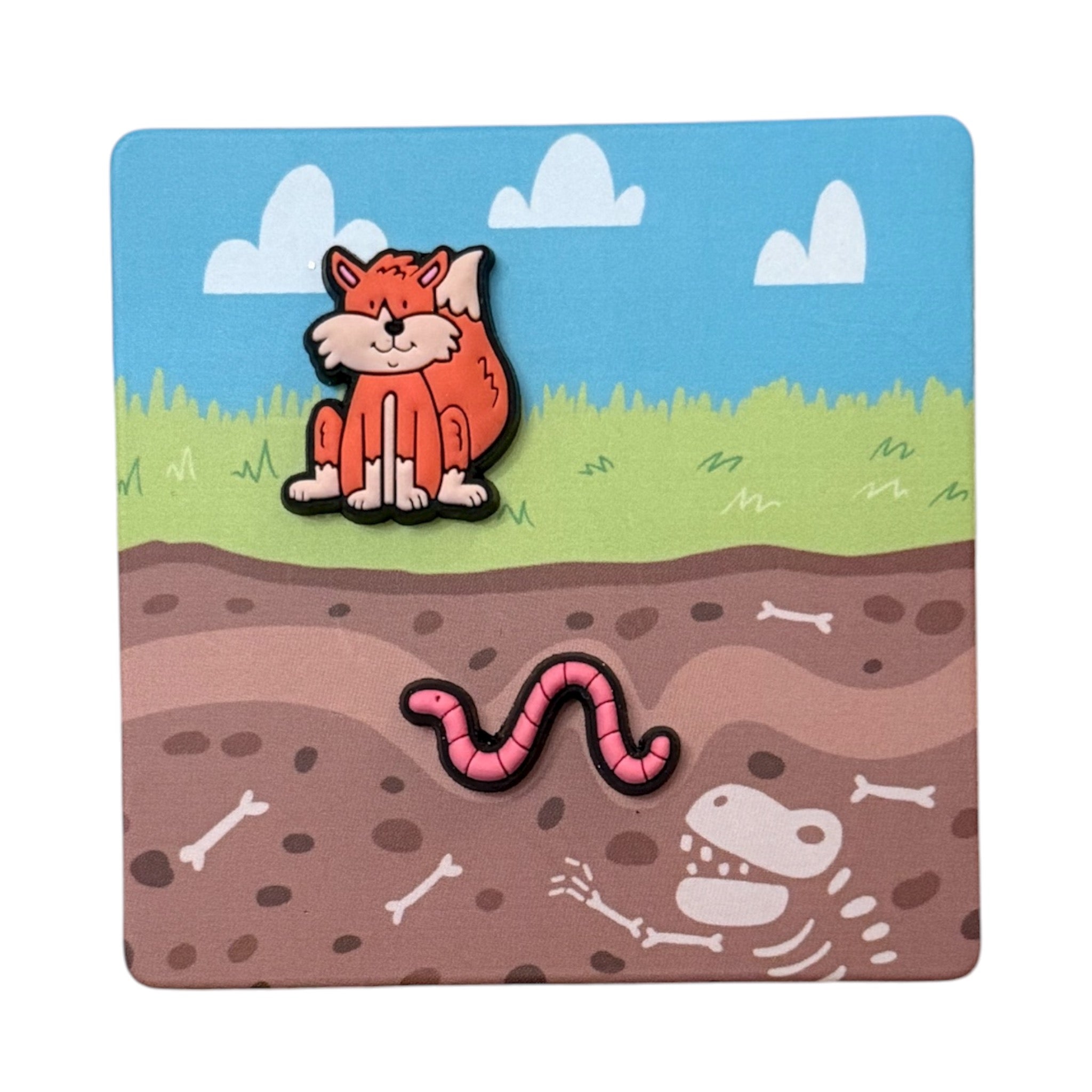 Patch of a fox and worm on a background with grass, sky, and bones Bjorem Speech Minis