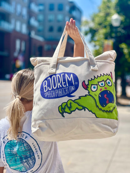 Child carrying the Bjorem monster canvas tote bag
