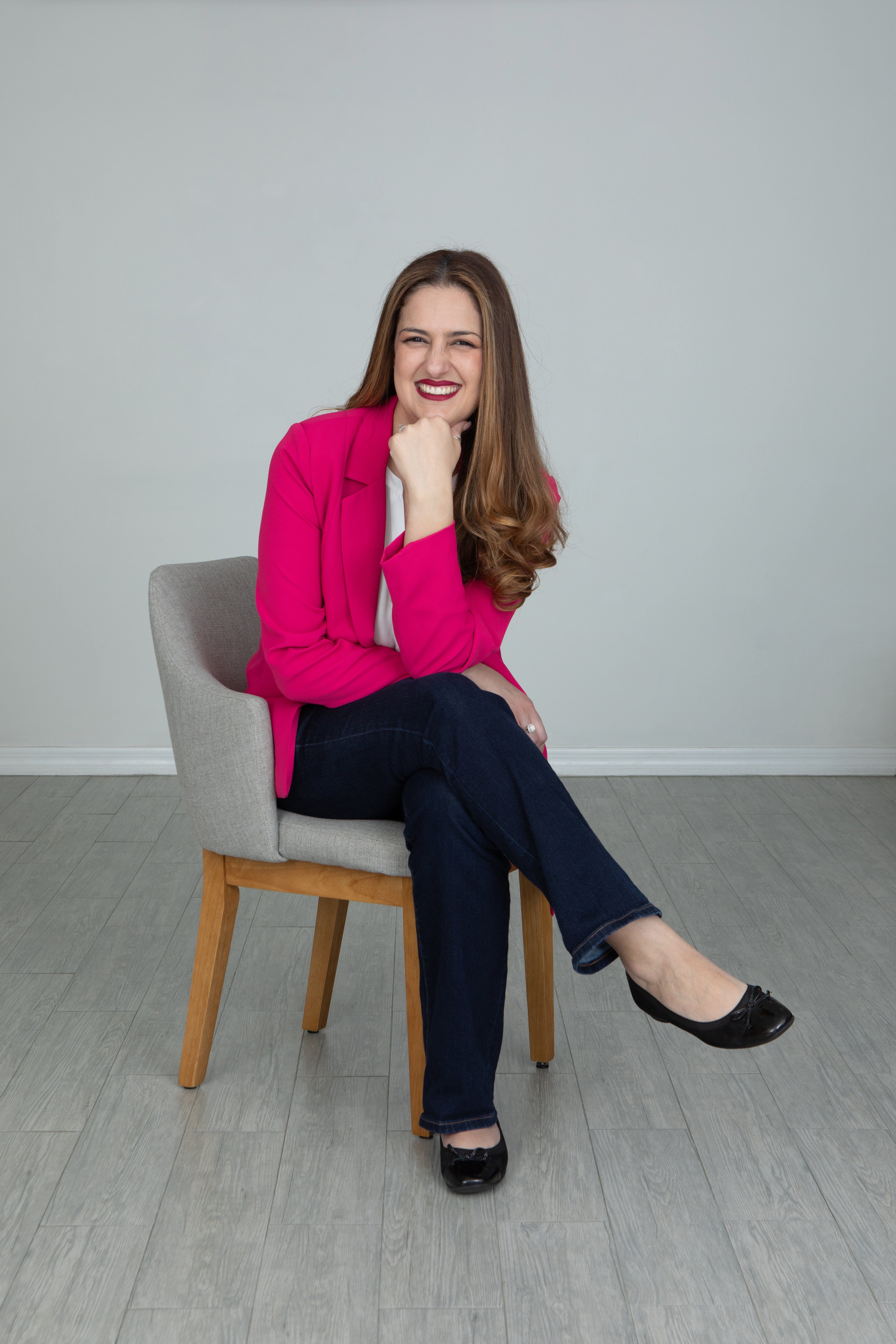 Martha Boiardt headshot, smiling in pink blazer