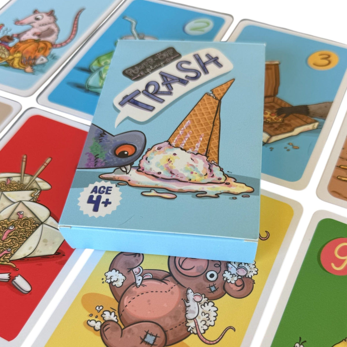 Close up of Trash card game cards and box